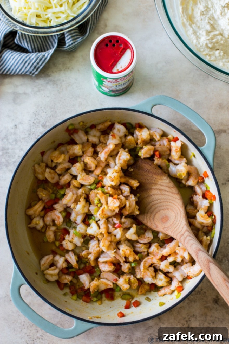 Creole Shrimp Kick 3 Overhead photo of a round baking dish filled with raw, chopped shrimp, ready for cooking.