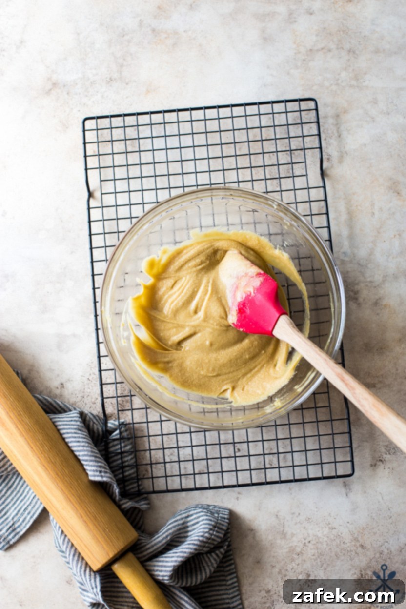 Overhead photo of a glass bowl filled with tart filling on a wire rack