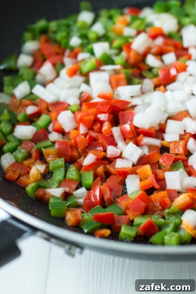 Creamy Cajun Corn Maque Choux 5 Another perspective of the Corn Maque Choux, perhaps showing it being stirred or ready to be served, emphasizing its creamy texture.