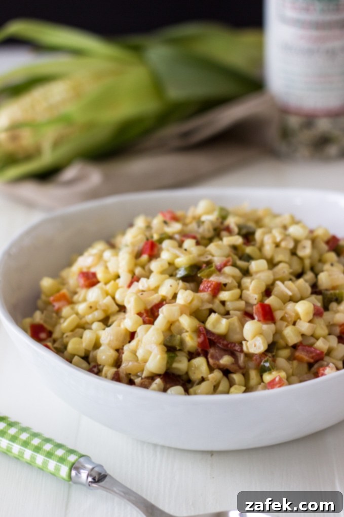 Creamy Cajun Corn Maque Choux 6 The final delicious serving of Corn Maque Choux in a bowl, garnished and ready to be enjoyed, highlighting its creamy, rich texture.