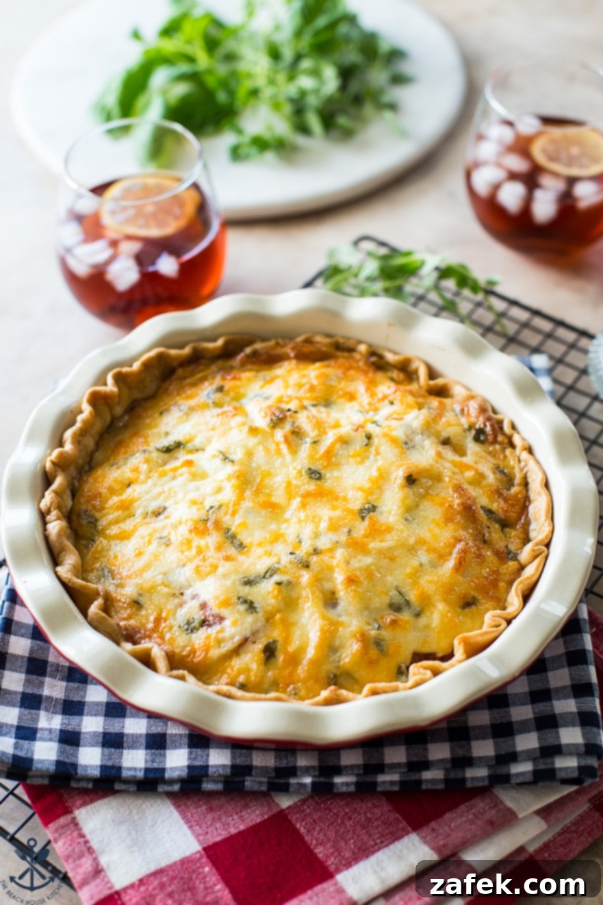 Rustic Summer Tomato Pie 7 Cheesy tomato pie on two checked napkins with two glasses of iced tea in the background