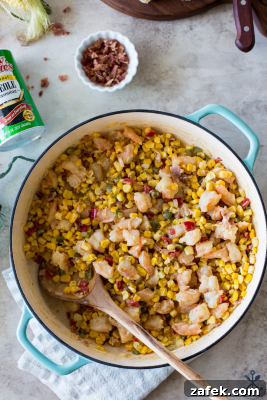 Overhead photo of a baking dish filled with shrimp maque choux, ready to be served.