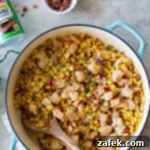 Overhead photo of a baking dish filled with shrimp maque choux, ready for serving.