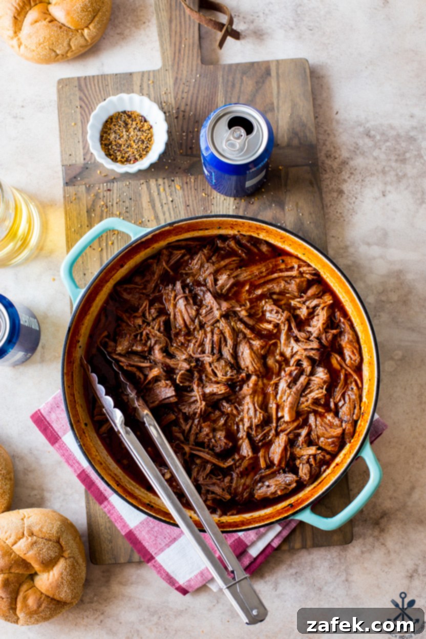 Overhead photo of a skillet of Beer-Braised BBQ Chuck Roast