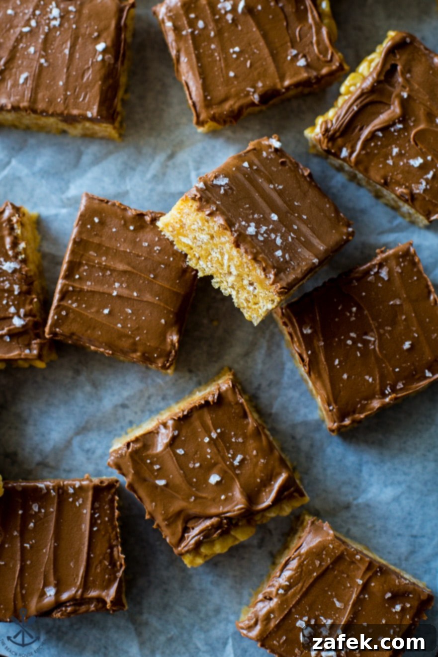 Sweet and Salty Peanut Butter Crunch Bars 4 The golden brown base of Scotcheroos, freshly pressed into a baking pan, awaiting its topping