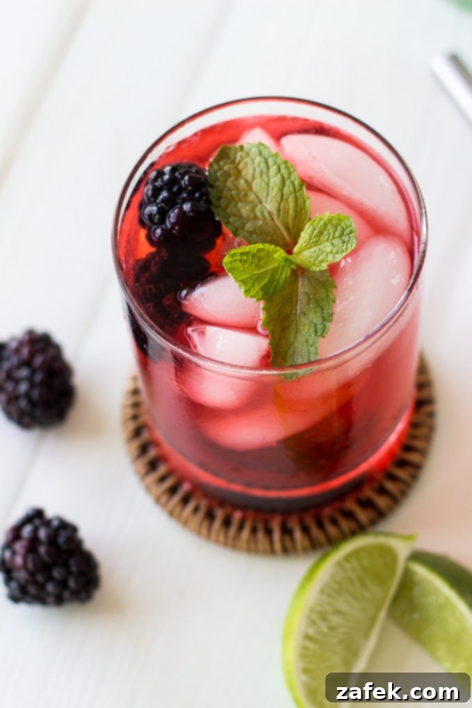 Midnight Bramble Refresher 3 Close-up of fresh blackberries and mint leaves, key ingredients for a mojito