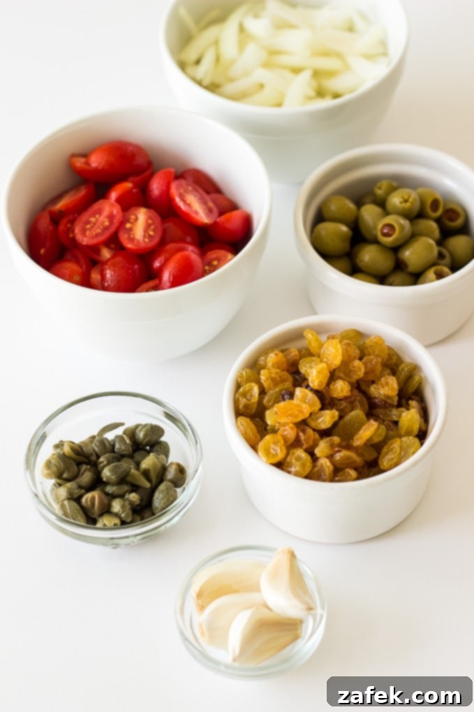 Zesty Mediterranean Chicken with Tomatoes, Olives and Capers 3 Close-up of Mediterranean Chicken in a skillet