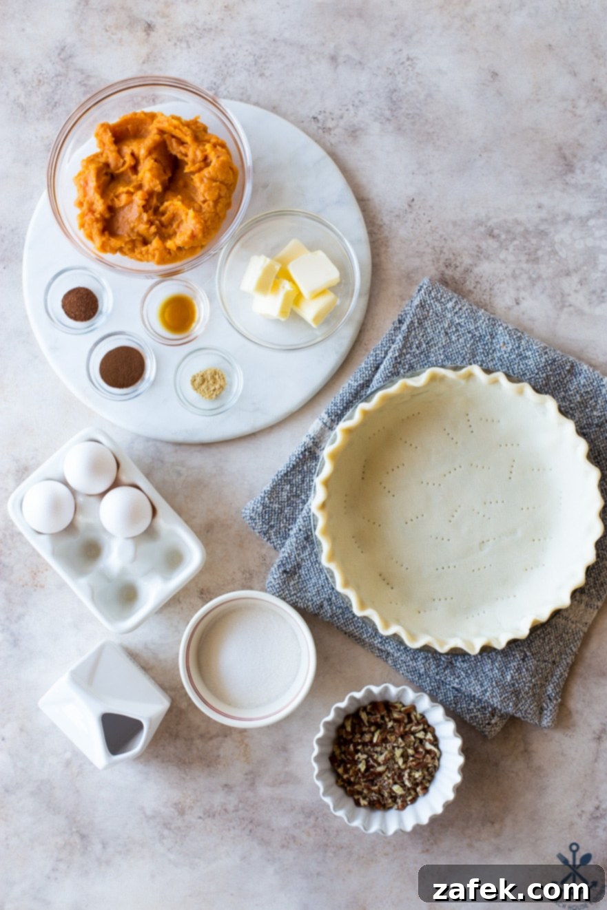 Sweet Potato Pie, Crowned with Pecans 3 Overhead photo showcasing the array of ingredients for sweet potato pie with pecan topping, neatly arranged on a rustic wooden surface.