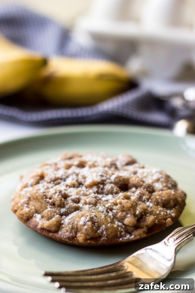 Banana Crumb Cake Muffin Tops - Close-up of the crumbly streusel texture.