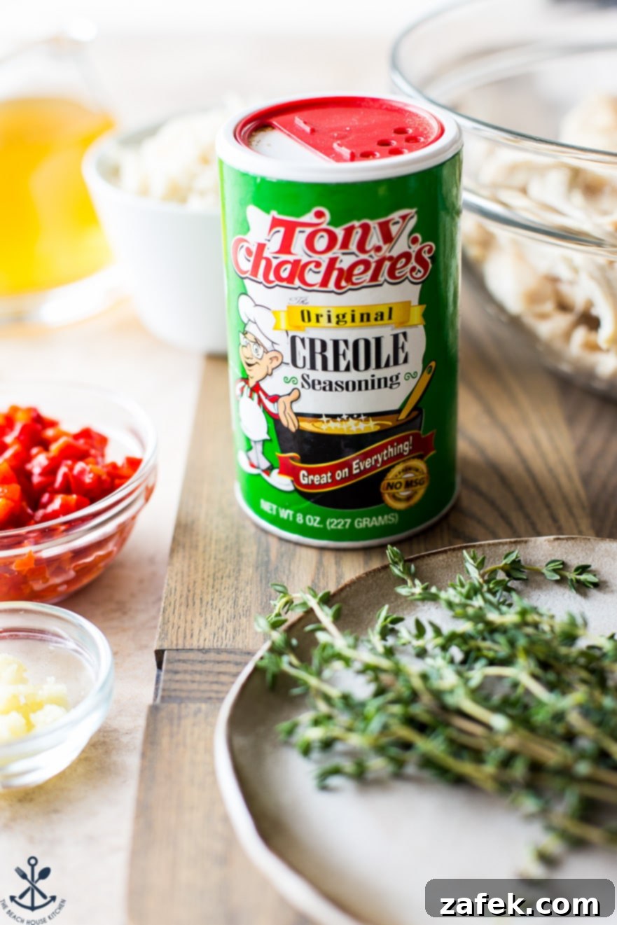 Soulful Cajun Chicken & Rice Soup 4 A close-up view of a classic can of Tony Chachere's Original Creole Seasoning, highlighting its iconic design and suggesting the bold flavors within.