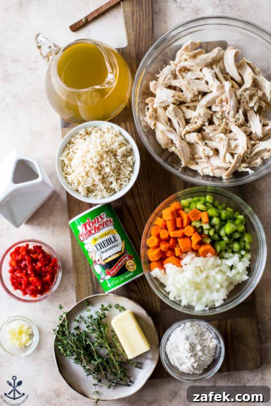 Soulful Cajun Chicken & Rice Soup 5 An overhead shot showcasing a beautiful arrangement of fresh ingredients for chicken and rice soup, neatly organized in individual bowls on a rustic wooden board, ready for cooking.