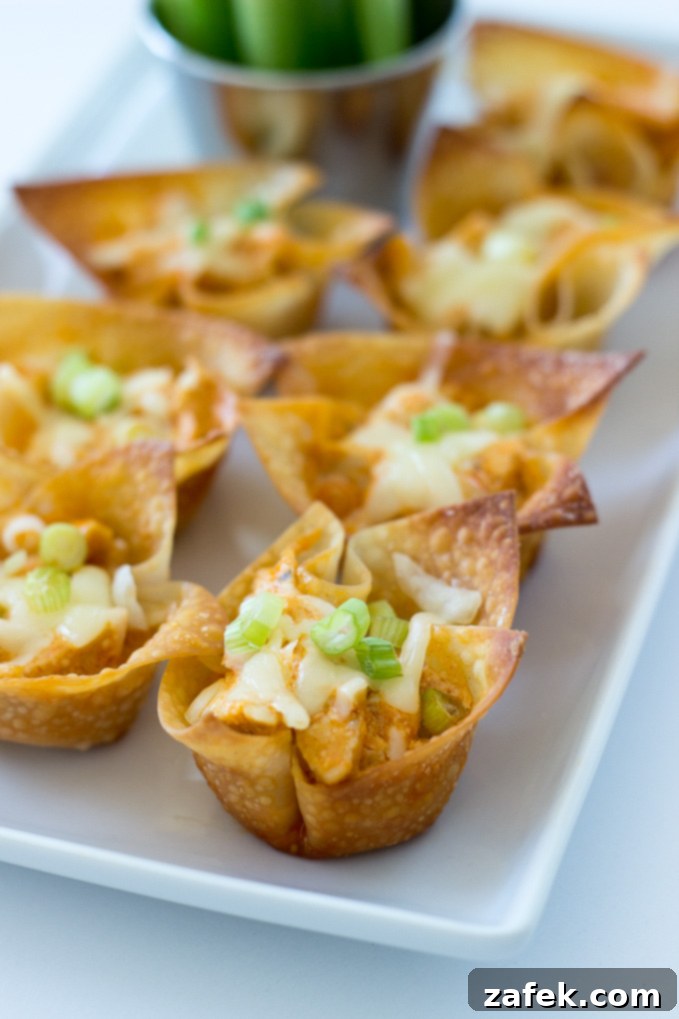 Crispy Buffalo Chicken Wonton Cups arranged on a platter, ready to serve.