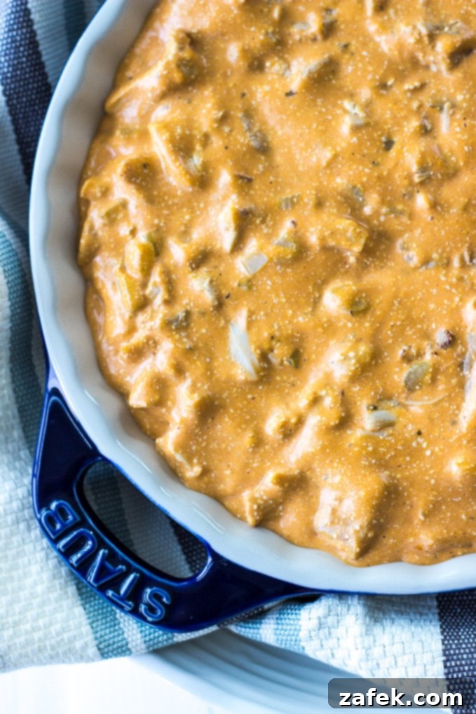 Buffalo Chicken Wonton Cups arranged on a wooden board with fresh celery sticks.