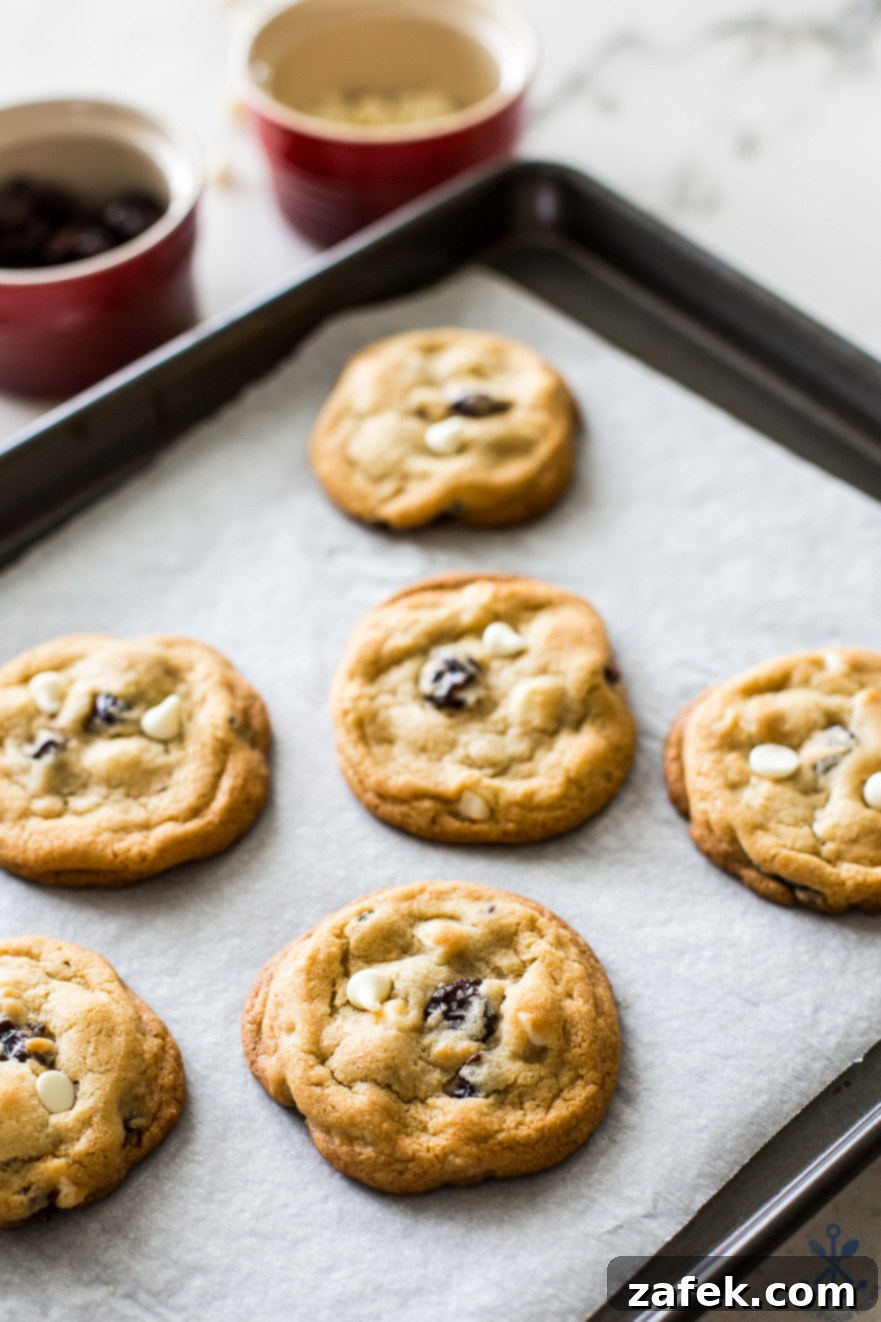 A parchment-lined tray of cookies