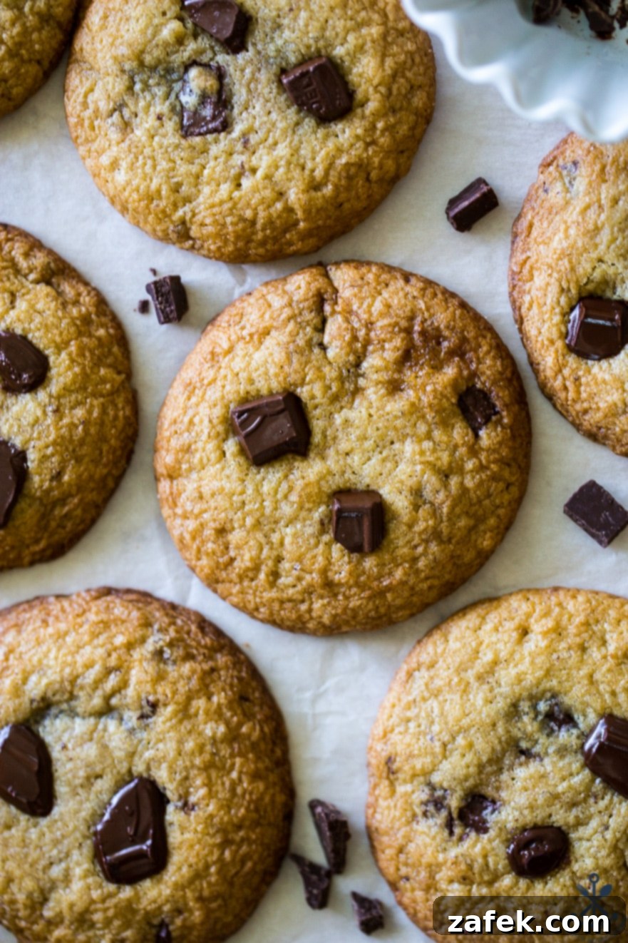Decadent Bananas Foster Chocolate Chunk Cookies 4 Close-up shot of several Bananas Foster Chocolate Chunk Cookies, showcasing their soft texture and generous chocolate chunks, ready to be enjoyed