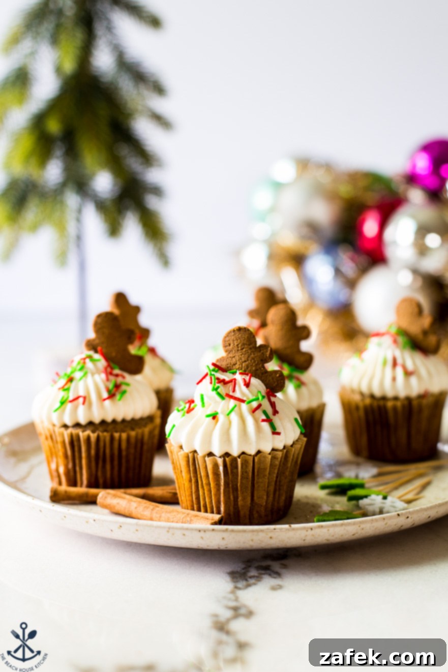 A plate of cupcakes with cream cheese frosting