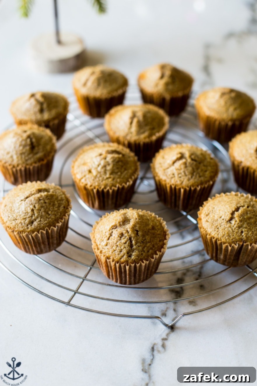 A round baking rack topped with chai cupcakes without frosting
