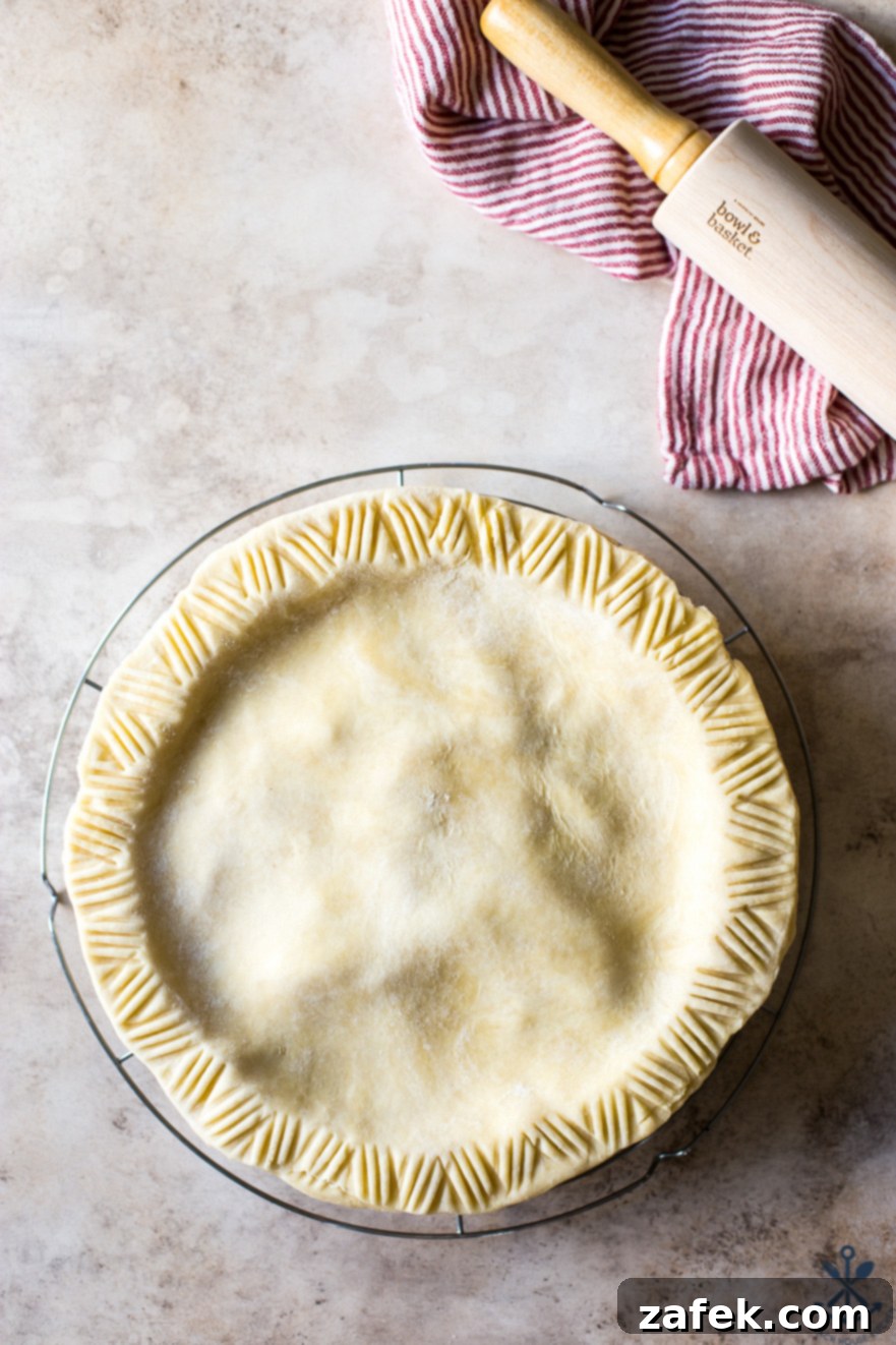 ShopRite's Holiday Apple Pie Fest 7 Overhead photo of a perfectly baked, golden-brown apple pie cooling on a wire rack, ready to be enjoyed.
