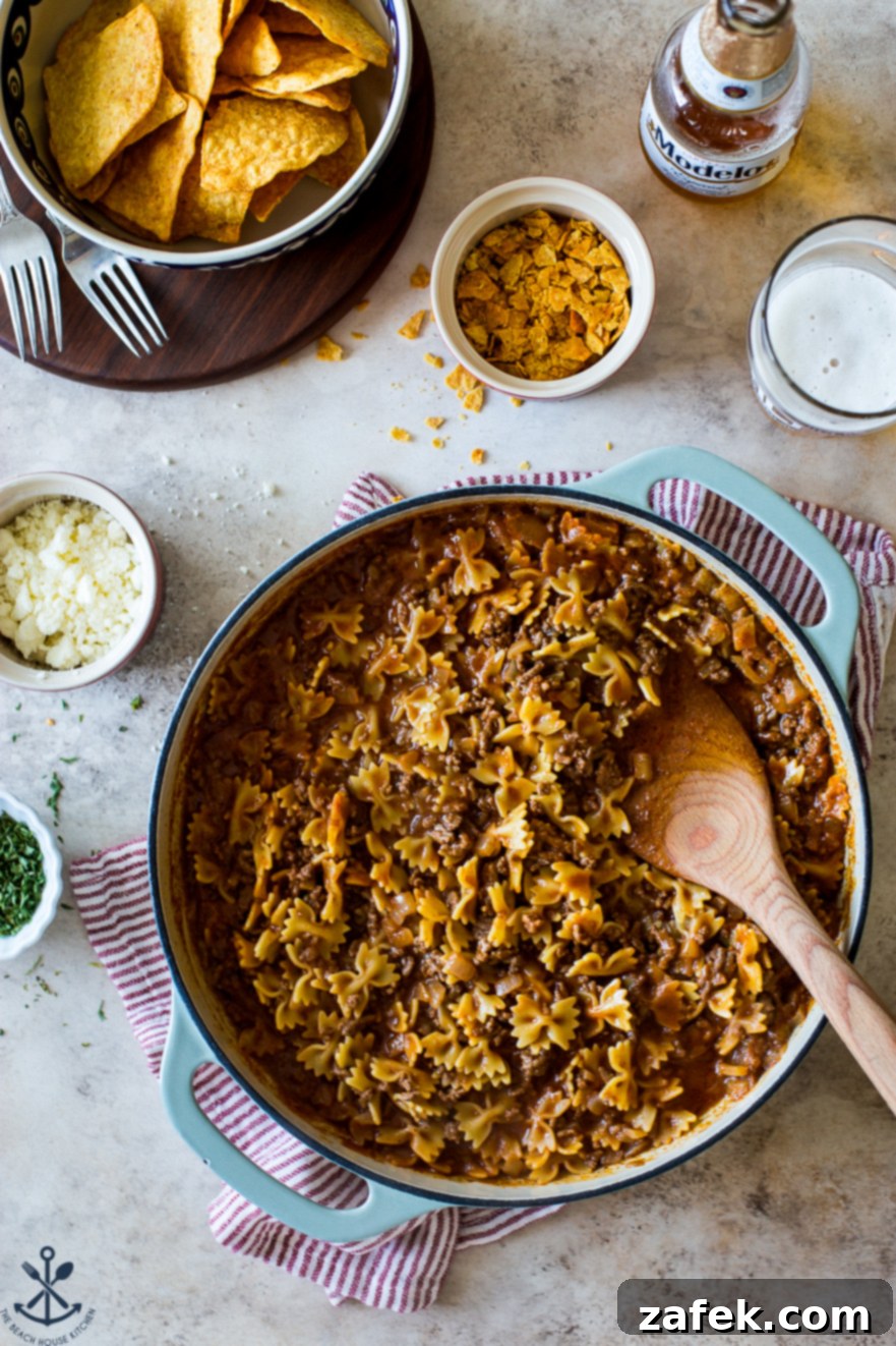 Creamy One-Pan Taco Beef Pasta 6 Overhead photo of a skillet with beef taco pasta