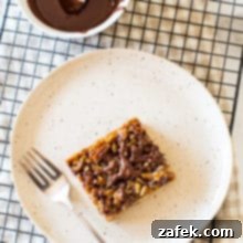 Decadent Maple Pecan Bars Adorned with Chocolate 8 Delicious Chocolate Drizzled Maple Pecan Bars ready to be served