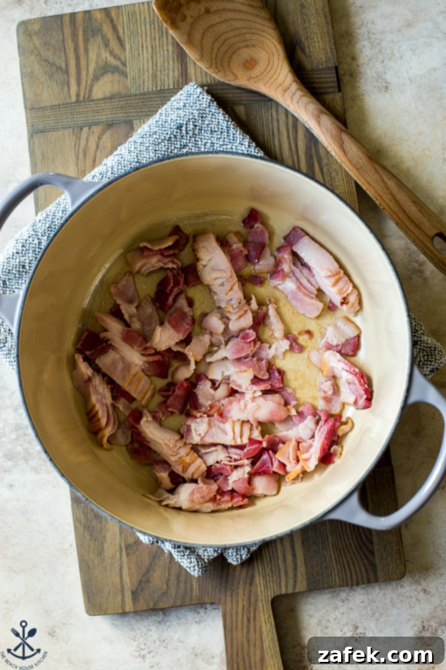 Bacon Cheddar Baked Potato Soup 8 Overhead photo of a pot of pre-cooked chopped bacon