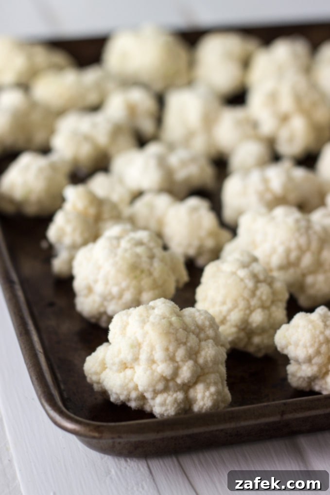Cauliflower florets simmering in a rich, creamy horseradish sauce