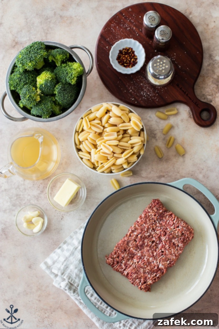 Overhead photo of ingredients for cavatelli, broccoli and Italian sausage