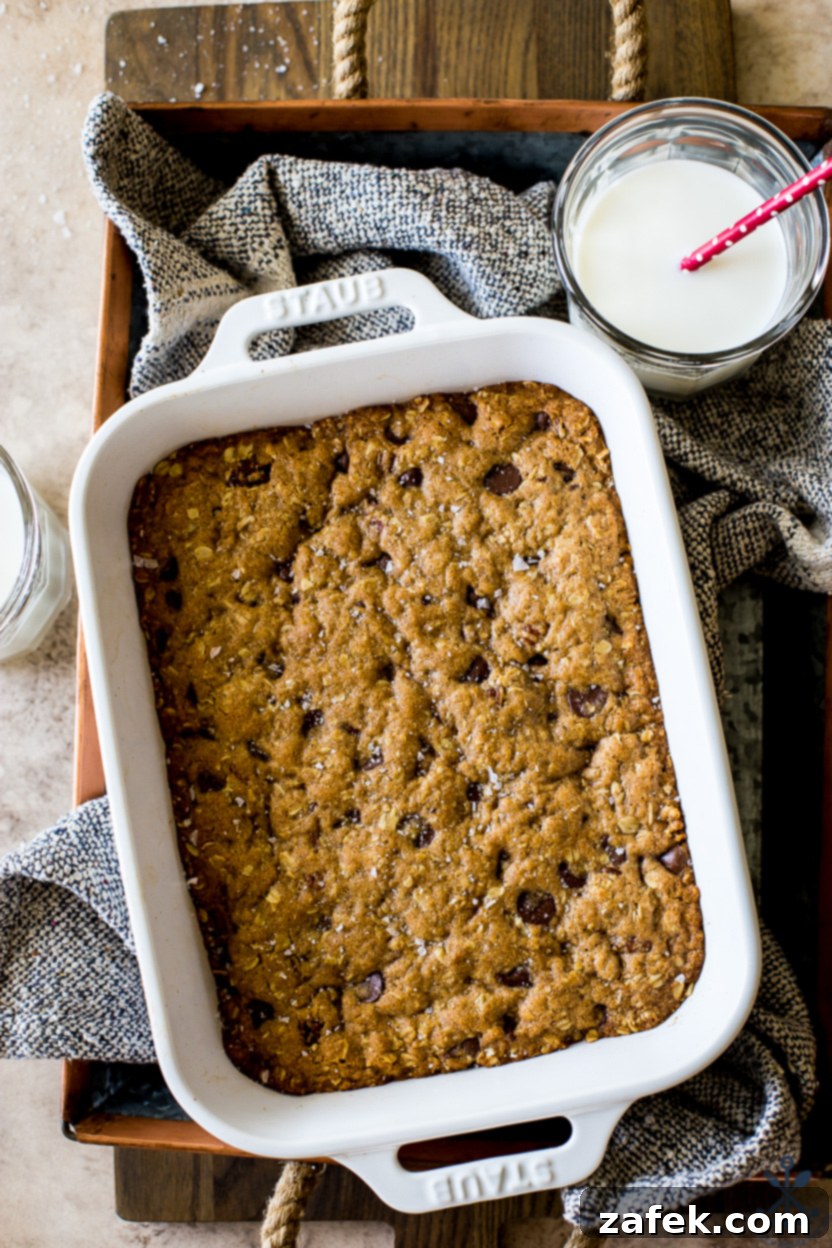 Chewy Oatmeal Chocolate Chip Bars 2 Up close overhead photo of a pan of oatmeal chocolate chip bars, fresh from the oven