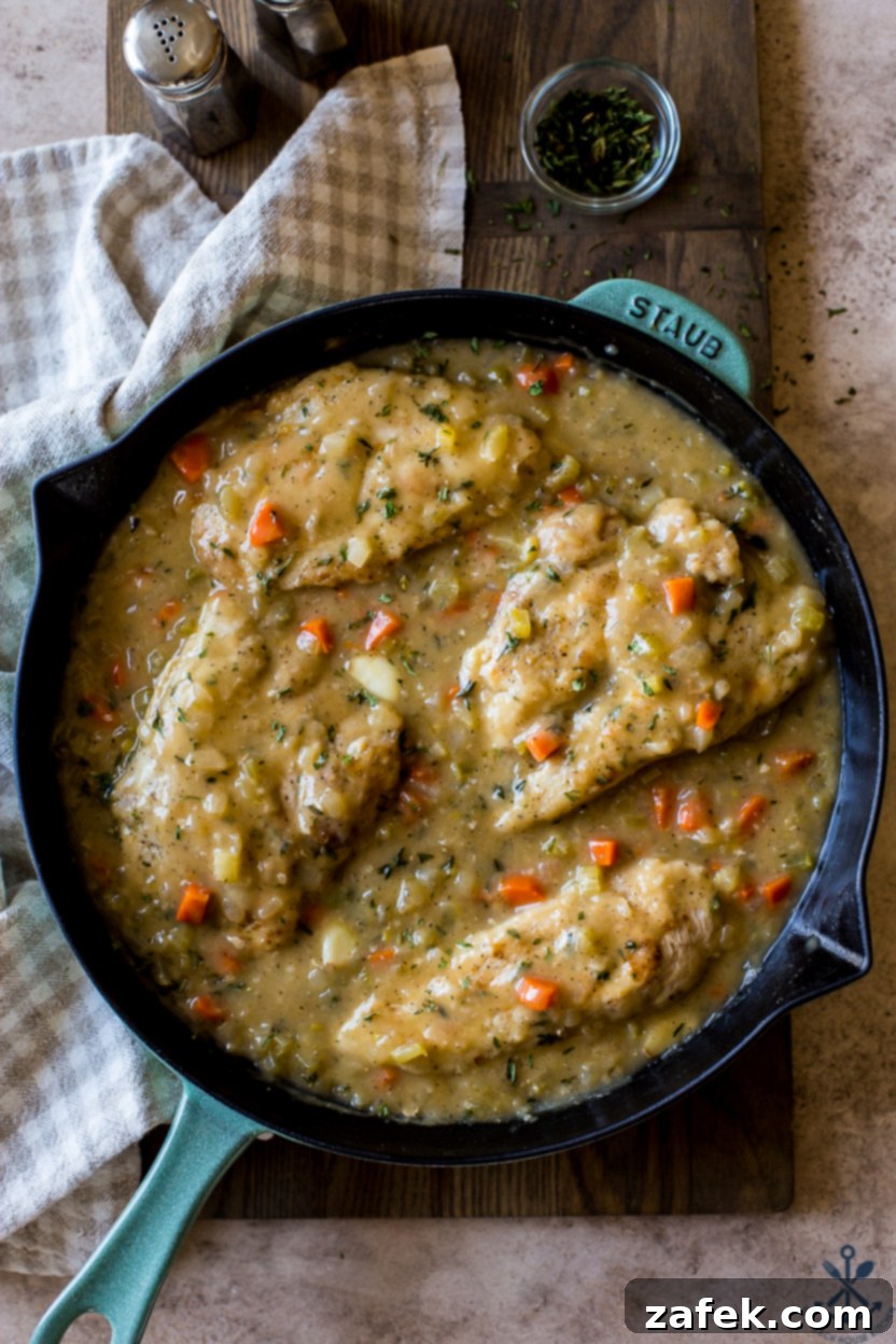 Garlic Chicken Delight 4 Up close overhead photo of browned chicken breasts in a skillet, showing a beautiful sear