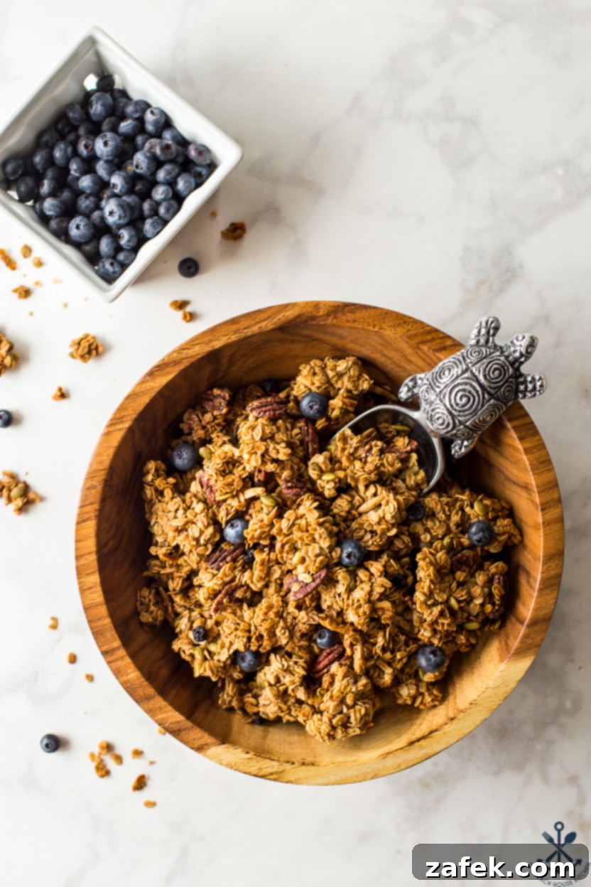 Sunshine Lemon Berry Crunch 4 Overhead photo of a bowl of granola and a carton of blueberries
