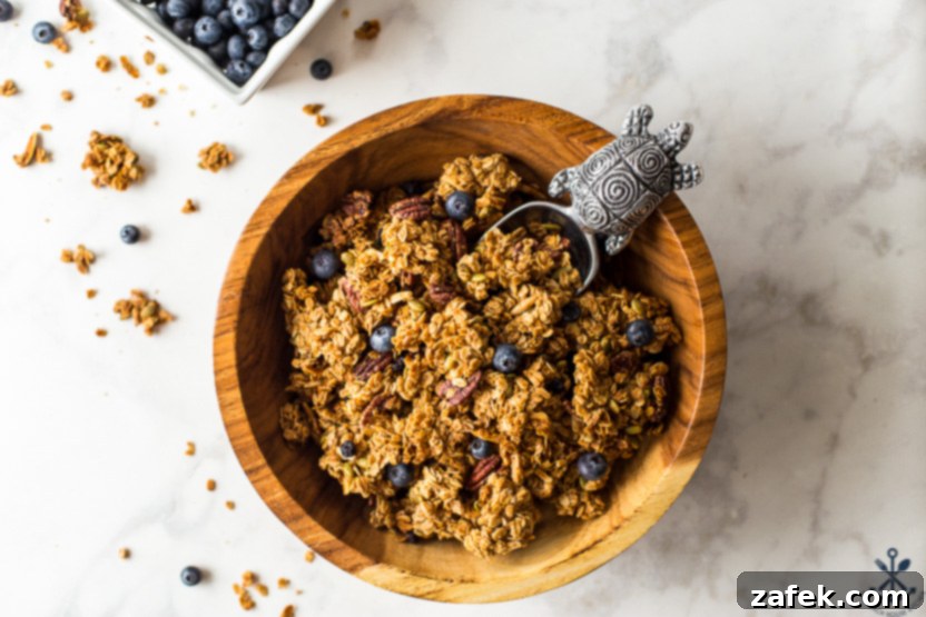 Sunshine Lemon Berry Crunch 7 Overhead photo of a landscape photo of a wooden bowl of granola