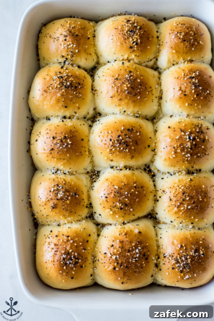 Up close photo of soft fluffy everything dinner rolls, showing the inside texture