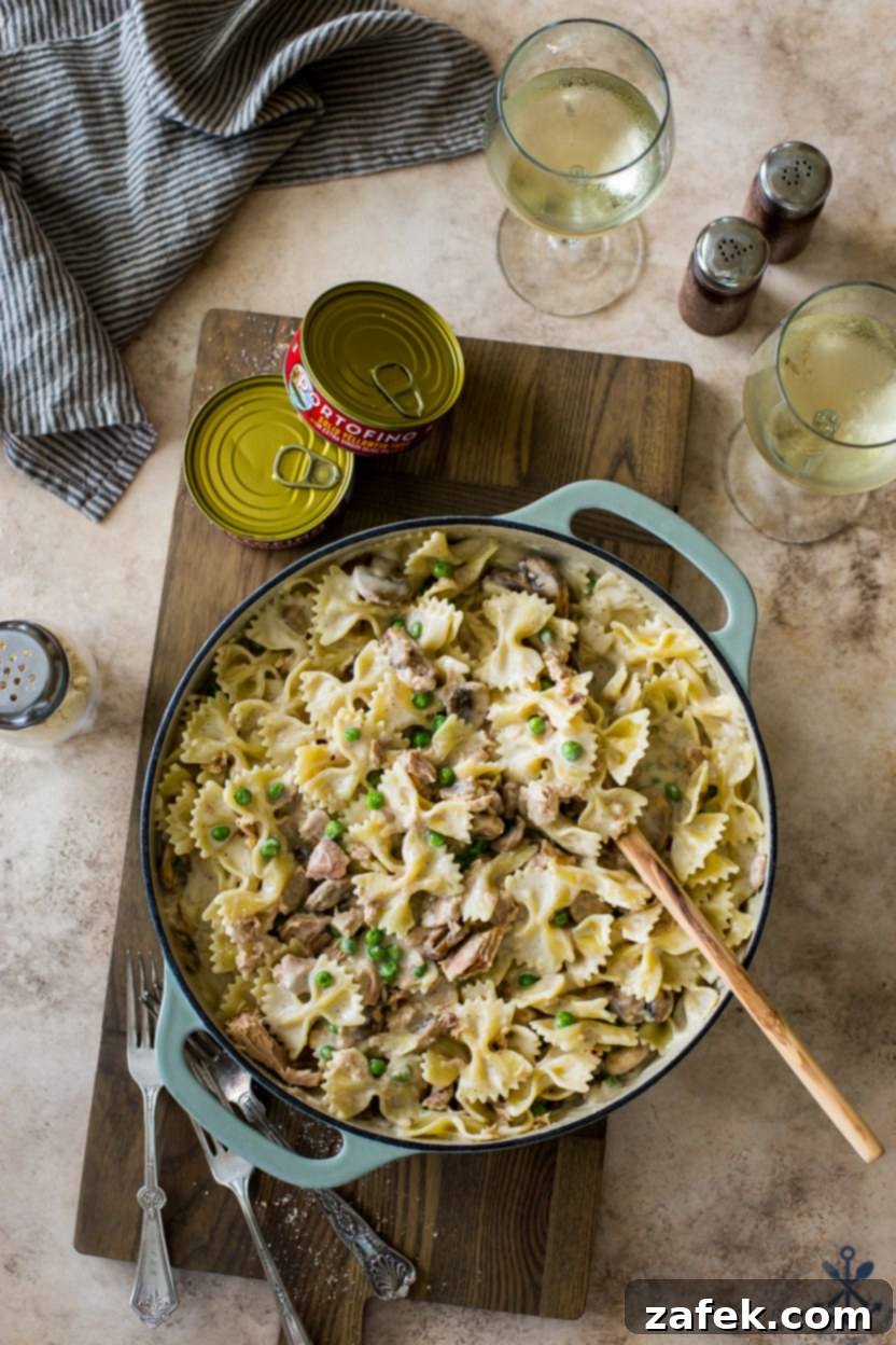 Savory Tuna Pasta with Earthy Mushrooms and Sweet Peas 2 Overhead photo of a skillet of tuna pasta with mushrooms and peas