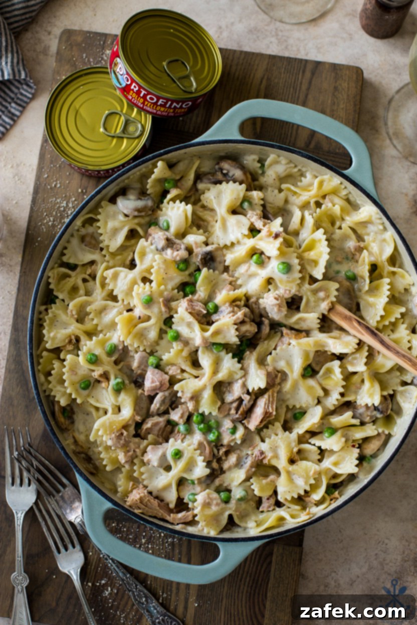 Savory Tuna Pasta with Earthy Mushrooms and Sweet Peas 3 Overhead photo of a skillet of pasta with peas mushrooms and tuna