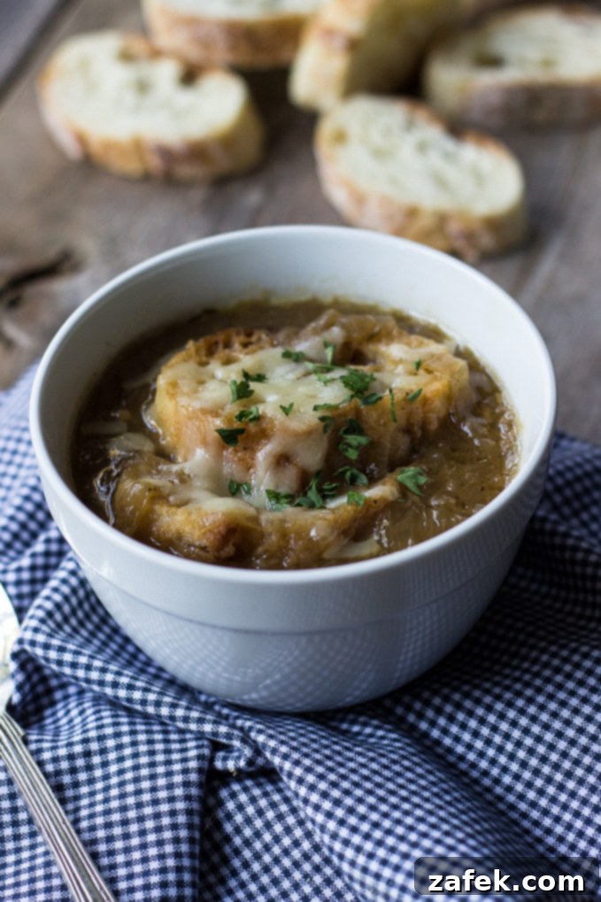 A large pot of rich Caramelized Onion Soup, ready to be served