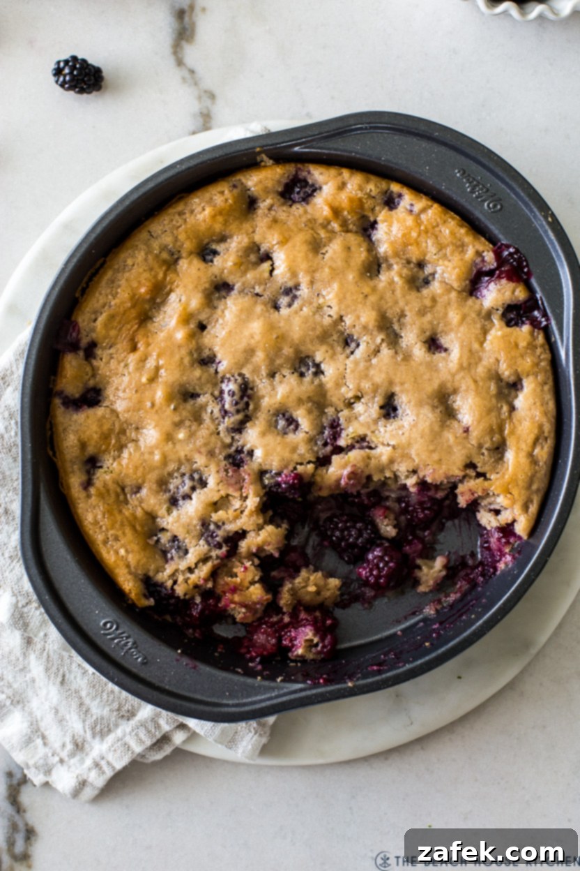 Overhead photo of a blackberry lime dessert in a round baking pan
