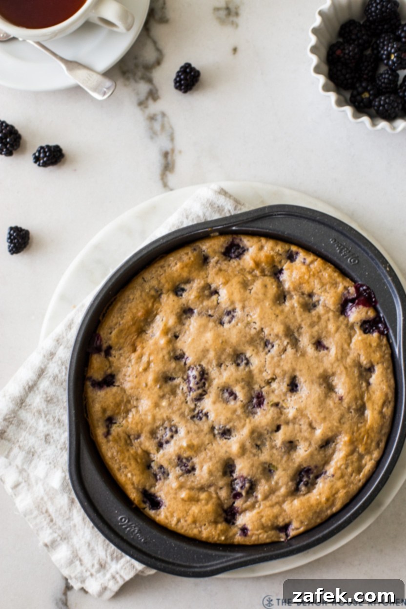Overhead photo of a blackberry slump in a round baking pan