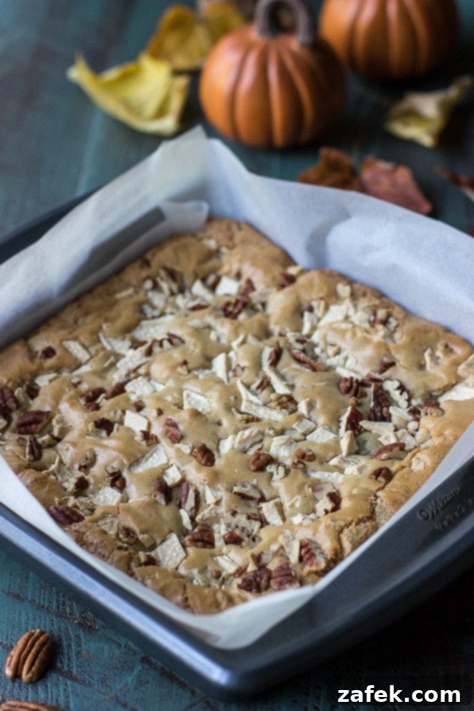 Serving a piece of Brown Butter Cranberry White Chocolate Pecan Blondie