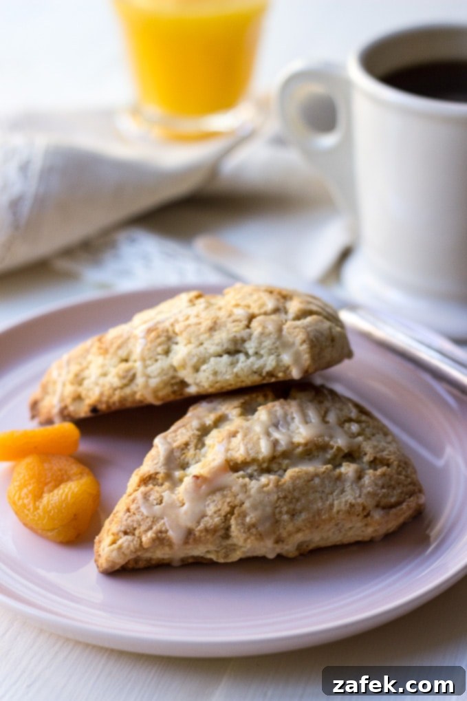 Maple Kissed Apricot Walnut Scones 3 Close-up of Apricot Walnut Scones with Maple Glaze, showing a tender interior
