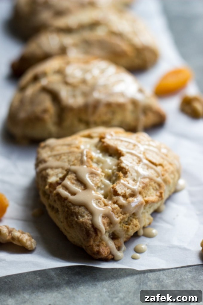 Maple Kissed Apricot Walnut Scones 6 Stack of Apricot Walnut Scones with Maple Glaze ready to be enjoyed