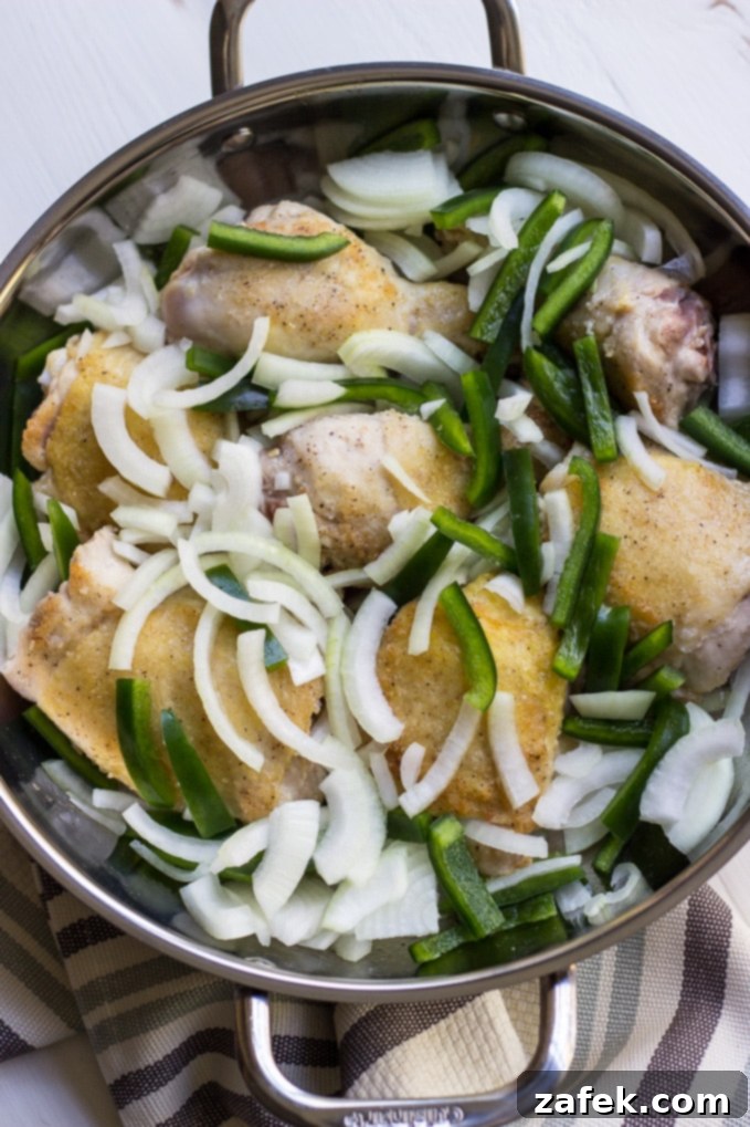 Vibrant Chicken Cacciatore 5 Chicken Cacciatore cooking in a cast iron skillet