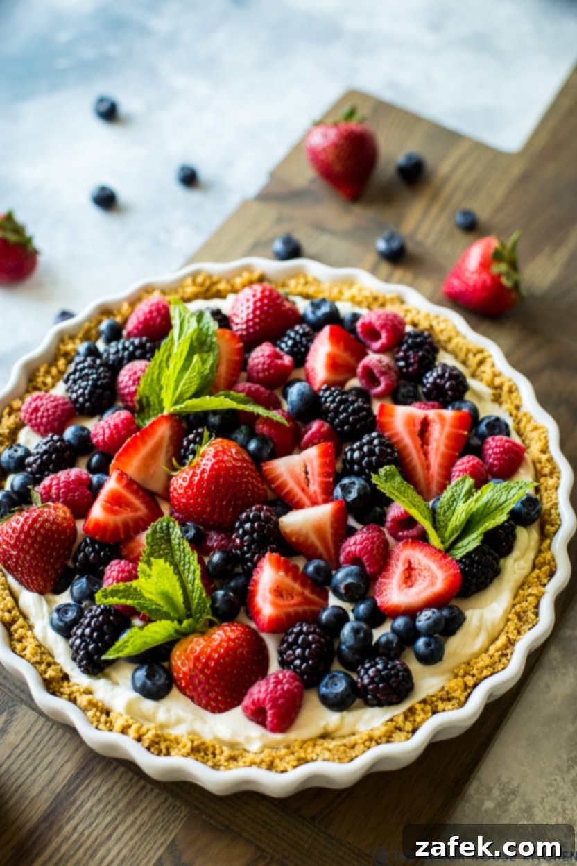 Vibrant Berry Tart 2 A fresh berry tart on a wooden board, showcasing its vibrant colors and inviting texture