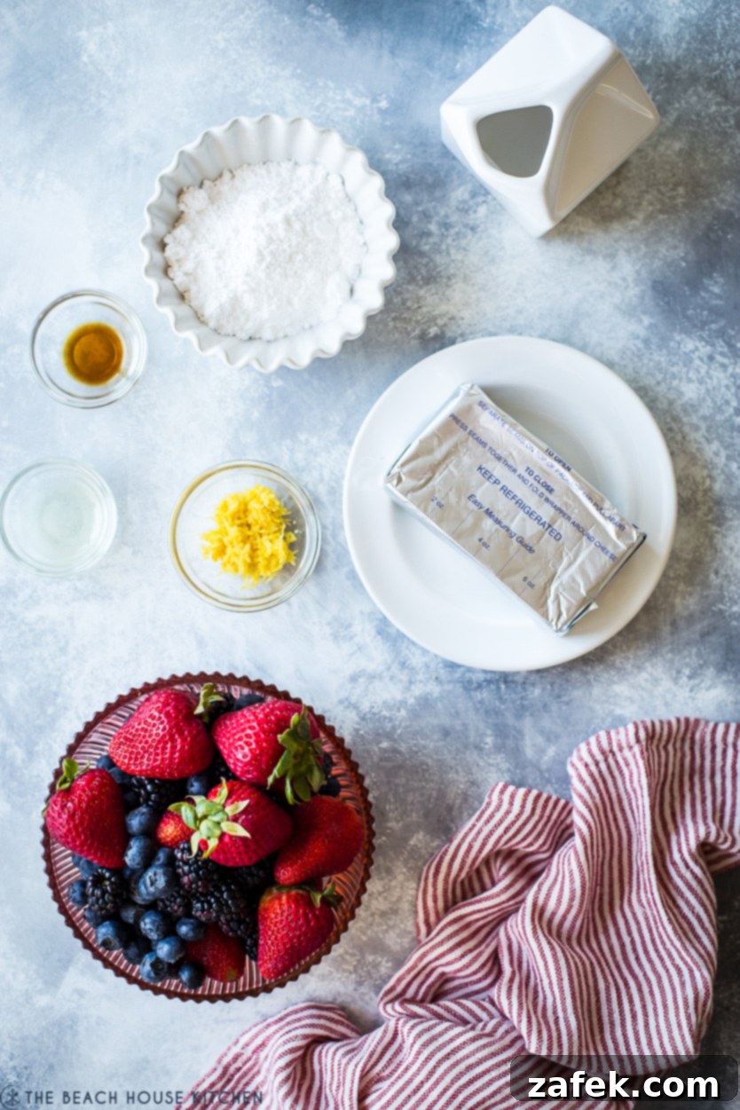 Vibrant Berry Tart 4 Overhead photo of fresh berry tart ingredients neatly arranged in bowls, including berries, cream cheese, and graham cracker crumbs