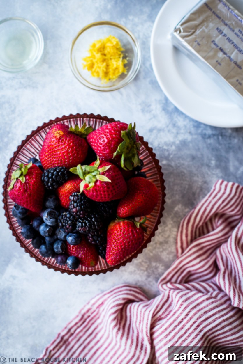 Vibrant Berry Tart 8 Up close overhead photo of a vibrant bowl overflowing with an assortment of fresh summer berries