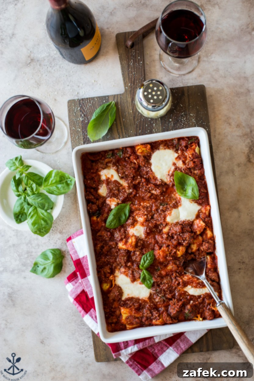 Cheesy Italian Sausage Tortellini Casserole 6 A serving of Italian Sausage Tortellini Bake, garnished with fresh basil, ready to be enjoyed.