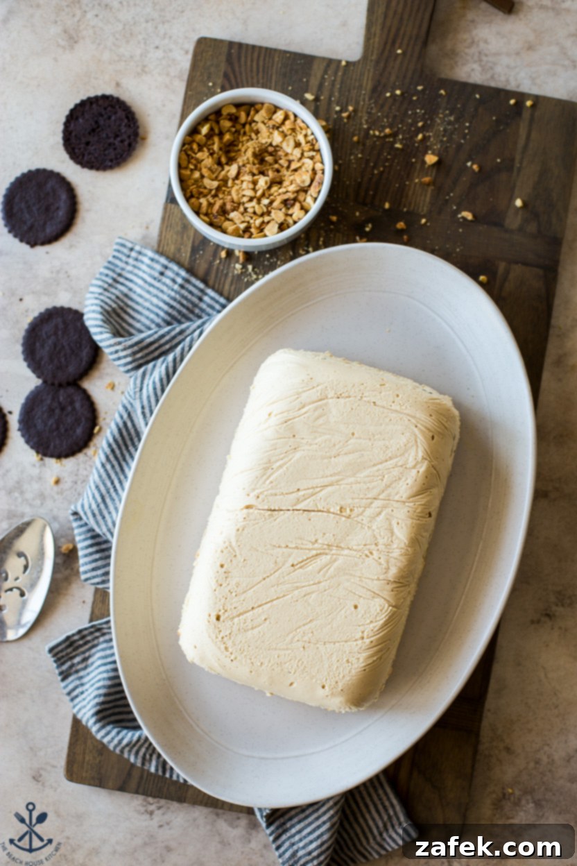 Decadent No-Bake Chocolate Peanut Butter Cake 7 Overhead photo of a pre-glazed peanut butter ice box cake on an oval plate, showcasing its ready-to-serve appeal
