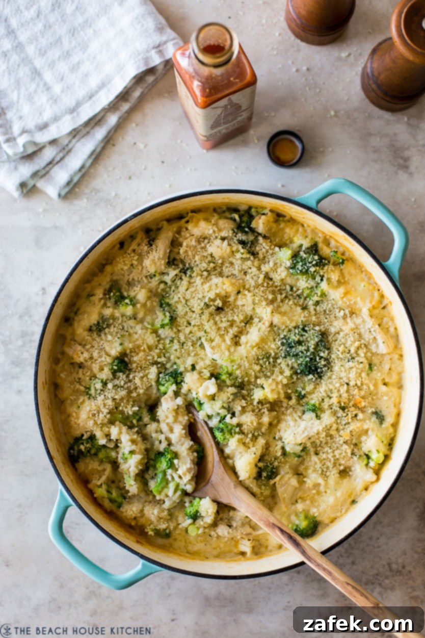 Creamy Chicken and Broccoli Rice Casserole 2 Overhead photo of a chicken broccoli dish in a round cast iron dish