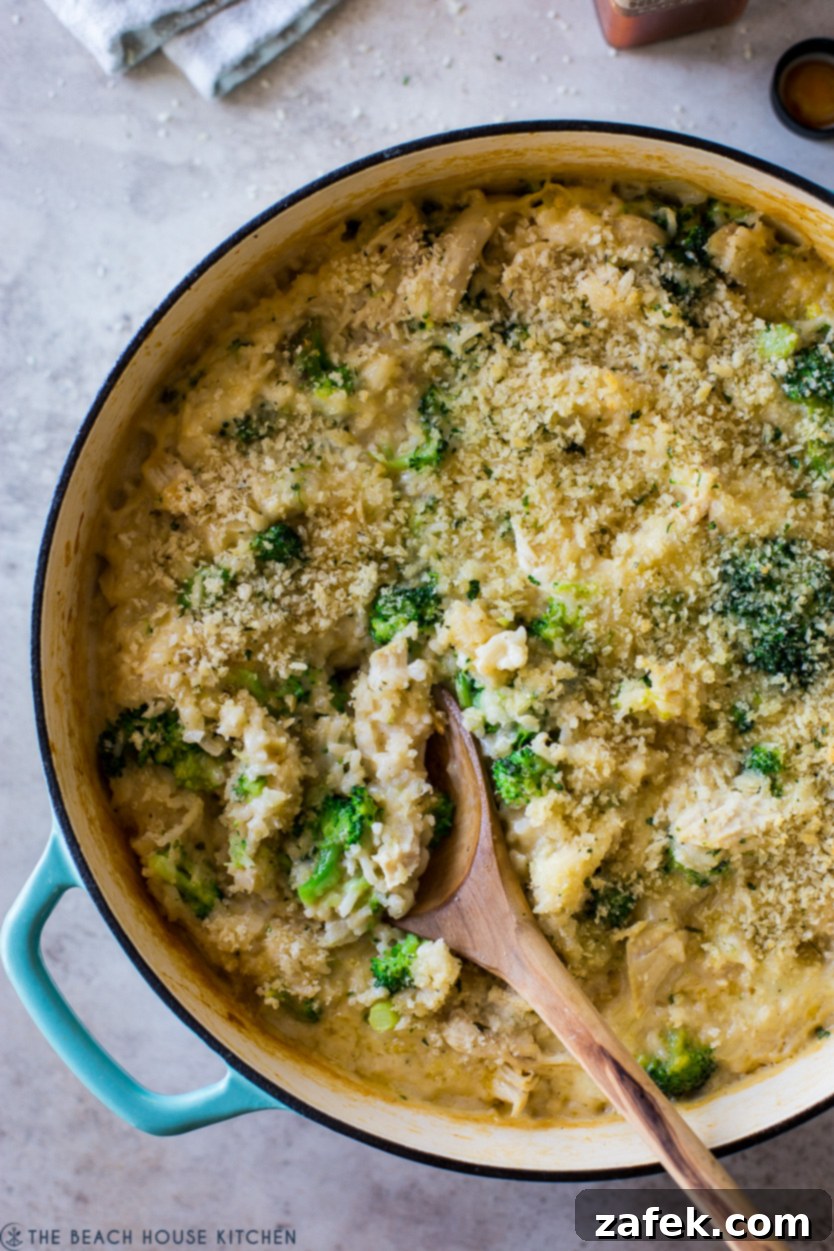 Creamy Chicken and Broccoli Rice Casserole 9 Up close overhead photo of a rice dish with chicken and broccoli