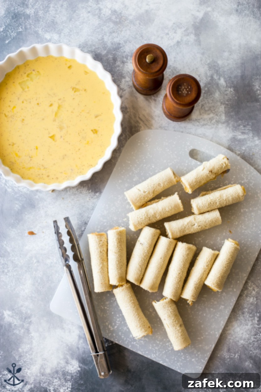 Overhead photo of French toast roll-ups alongside a plate of egg mixture and salt and pepper, illustrating the preparation and seasoning options for this versatile breakfast
