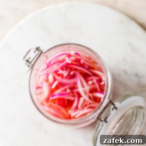 Overhead photo of a jar of pickled red onions